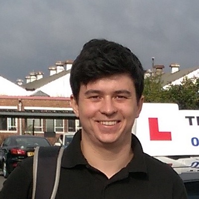 Headshot of former student Huw